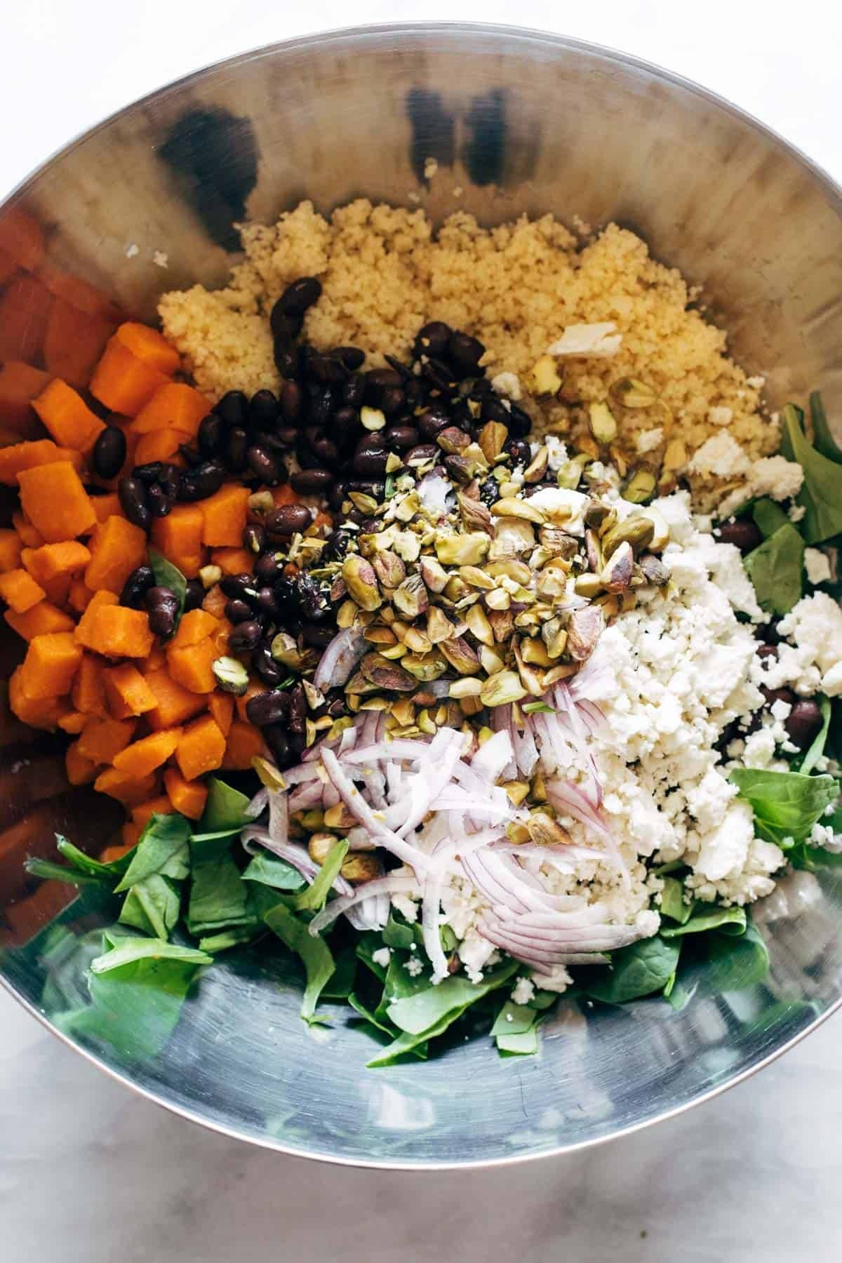 Couscous salad ingredients in a bowl.